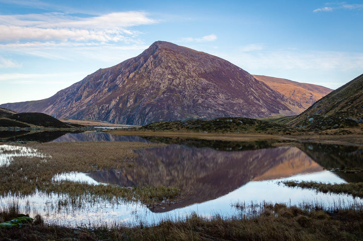 Reflections of a mountain in a lake in snowdonia.