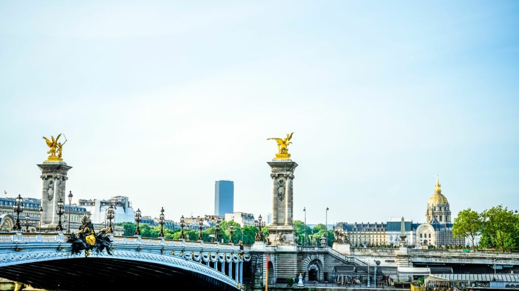 Capture of the Alexandre III bridge and Paris skyline with golden statues.