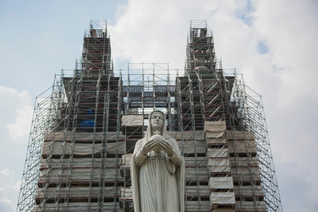 Notre-Dame Cathedral Basilica in Ho Chi Minh City under renovation with scaffolding.