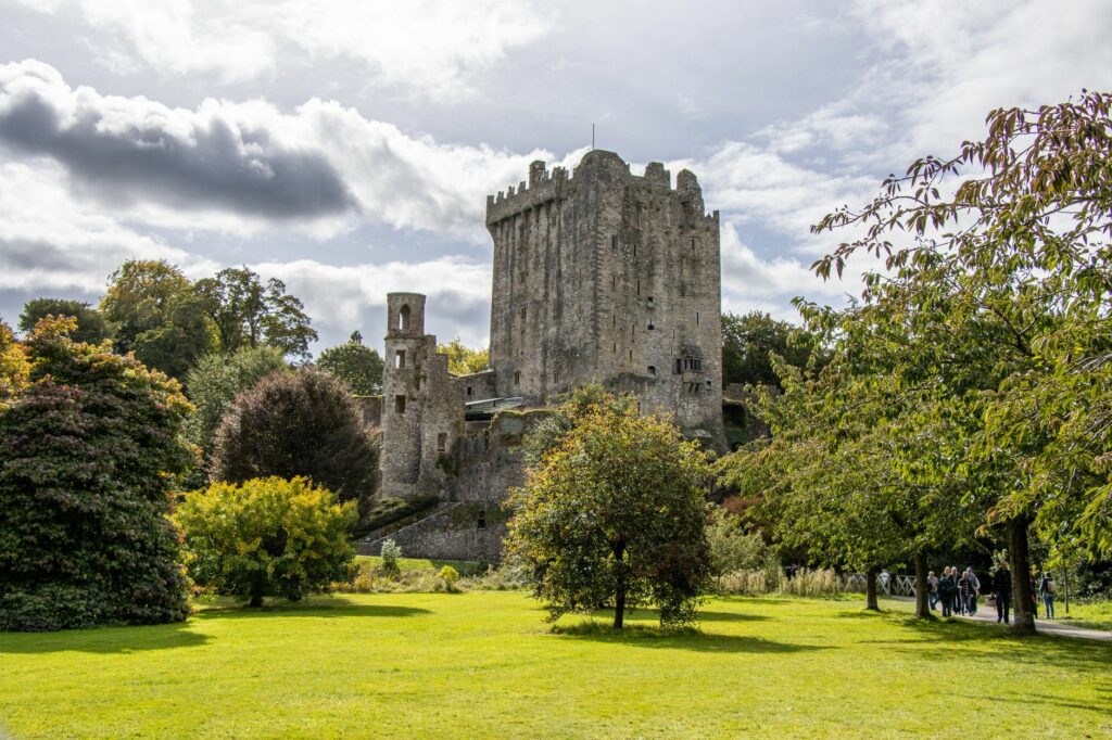 Blarney Castle surrounded by vibrant greenery in County Cork, Ireland.