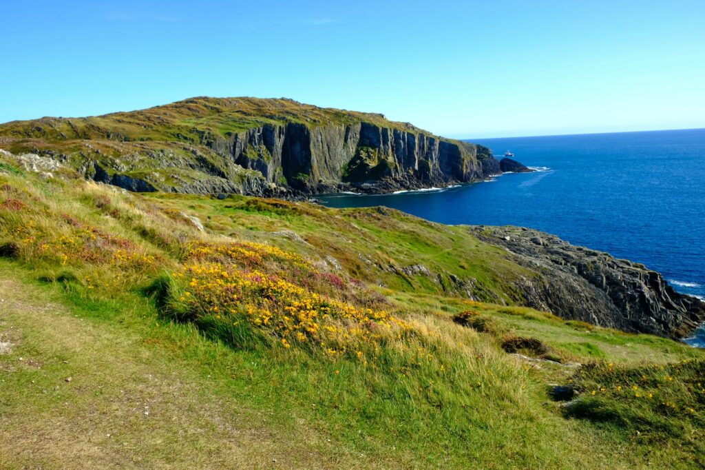 Vibrant coastal landscape of cliffs and ocean in Baltimore, Ireland.
