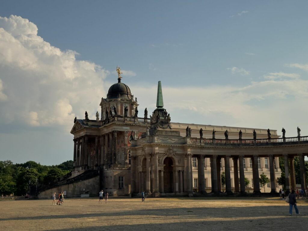 A beautiful view of a historic Baroque palace under a clear sky in Potsdam, Germany.