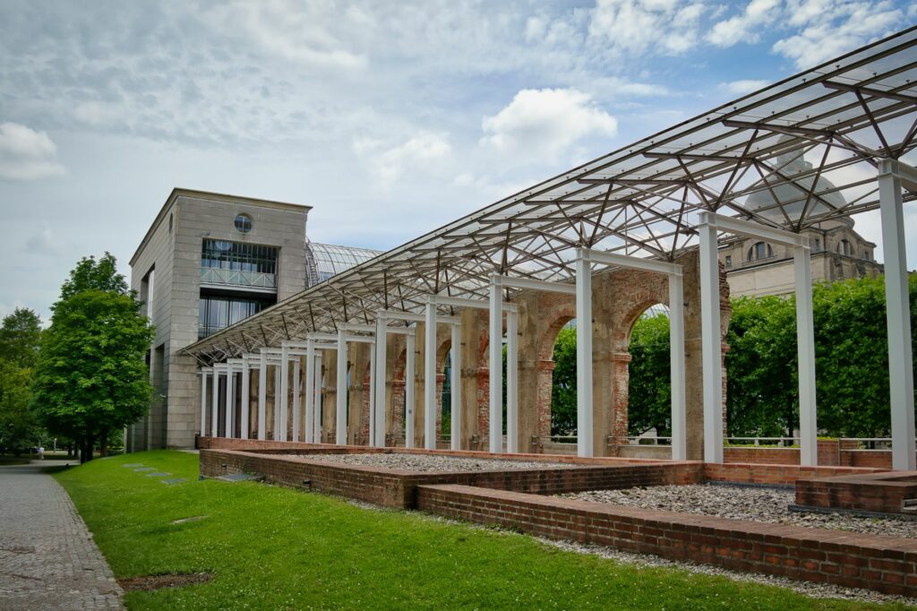 Outdoor view of structural design near Prinz-Carl-Palais, Munich, showcasing modern architecture and greenery.