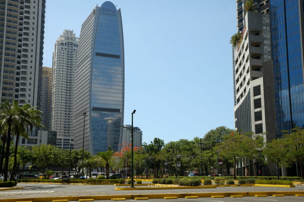 A daytime view of skyscrapers and greenery in Bonifacio Global City, Manila.