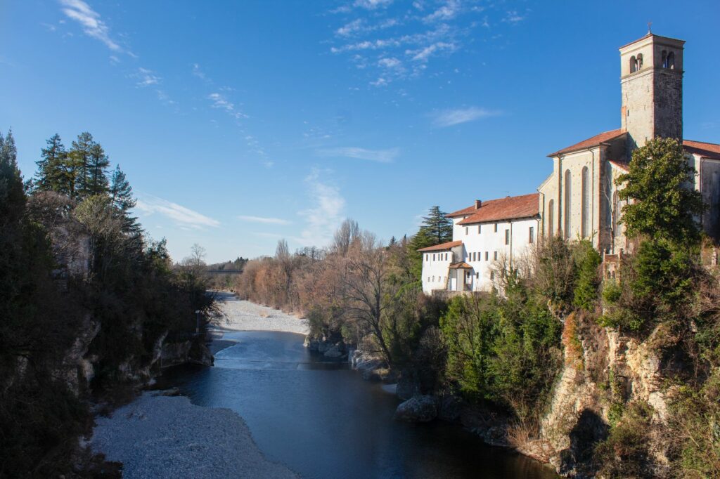 Breathtaking view of the river and historic architecture in Cividale del Friuli, Italy.