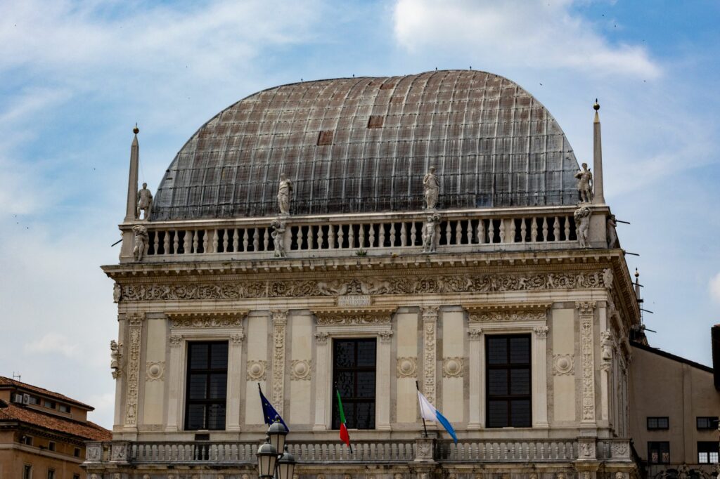 Explore the stunning architecture of Piazza della Loggia, Brescia, Italy.