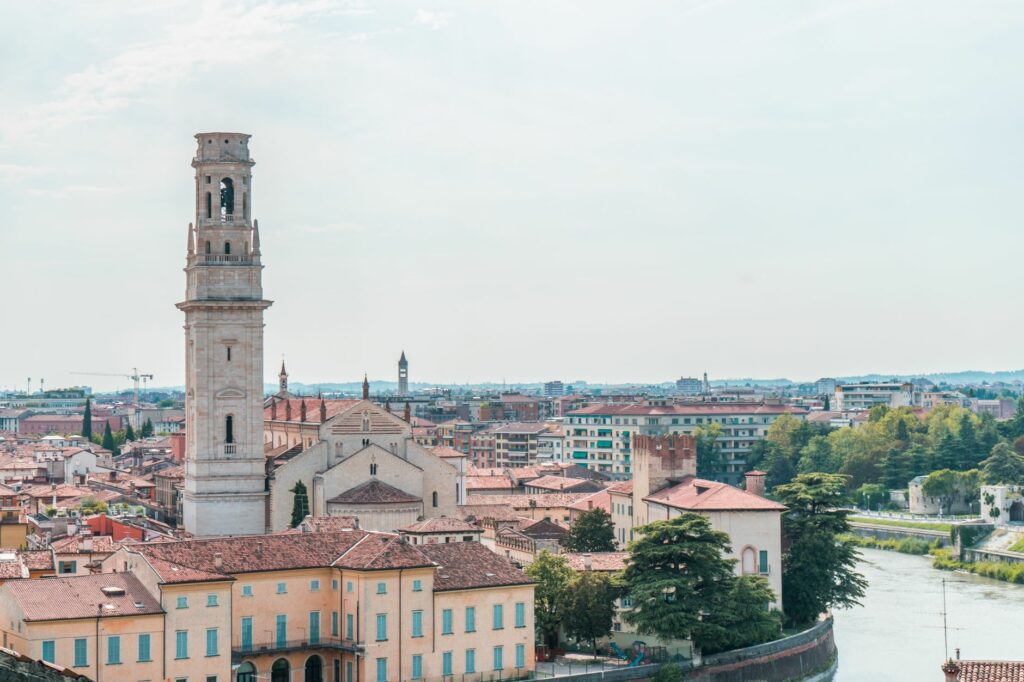 Stunning panoramic view of Verona's skyline featuring the prominent Torre dei Lamberti under a clear sky.