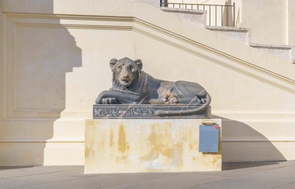 Ancient Egyptian lion statue at Vatican Museums, symbol of art and history.