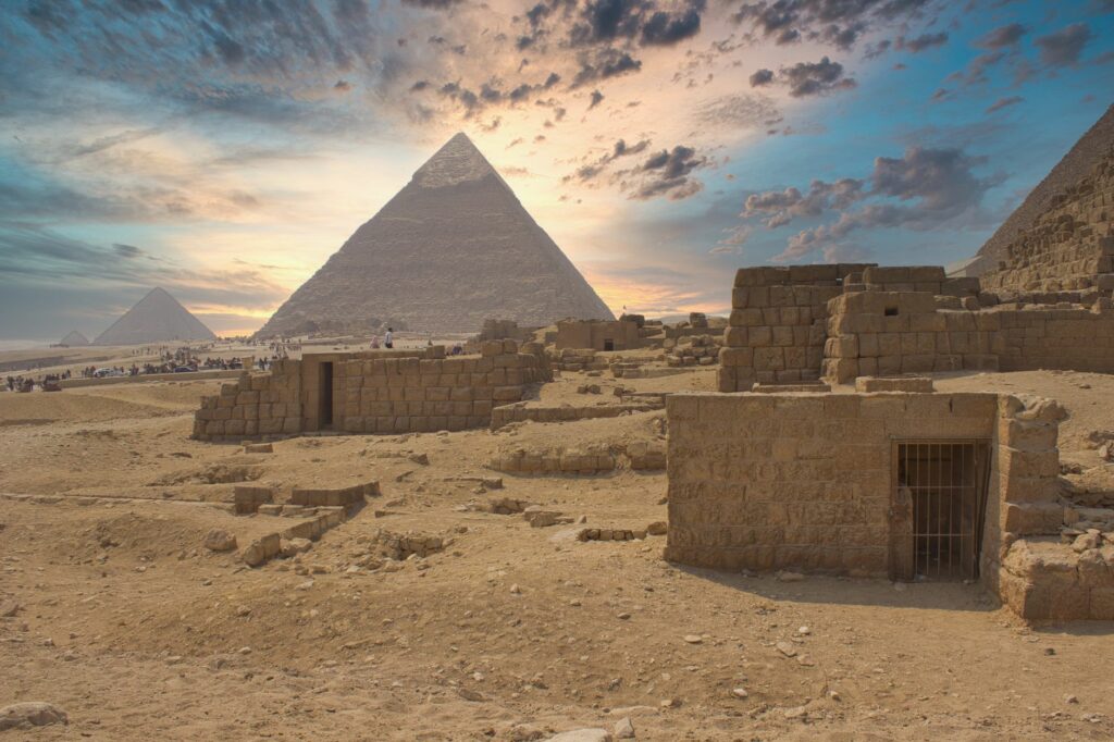 Captivating view of Giza Pyramids at sunrise in Cairo, showcasing ancient Egyptian architecture.