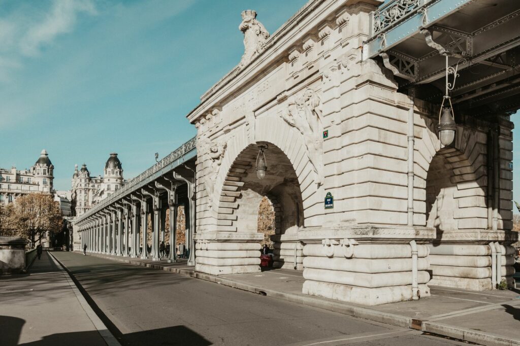 Detailed view of Pont de Bir-Hakeim, Paris with ornate architecture and clear sky, ideal for tourism.
